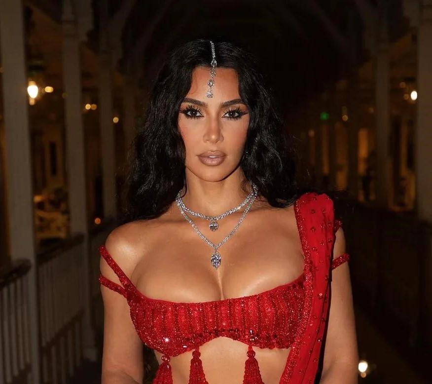 Kim Kardashian turned heads at the Ambani wedding in a stunning red saree by Manish Malhotra, highlighting her great fashion sense