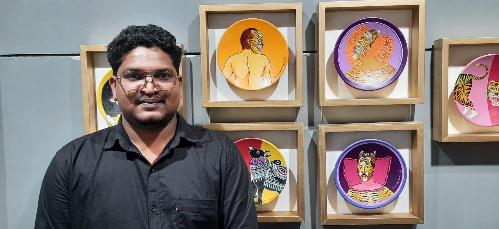 Kannu Behra with his terracotta paintings